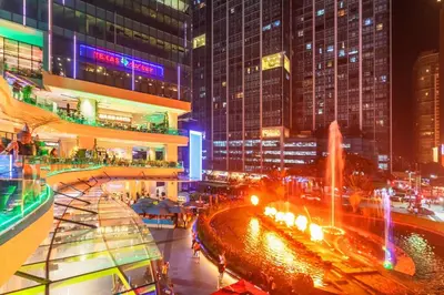 a view of a city at night with buildings at Stylish condo in BGC near Uptown mall and St Lukes in Manila
