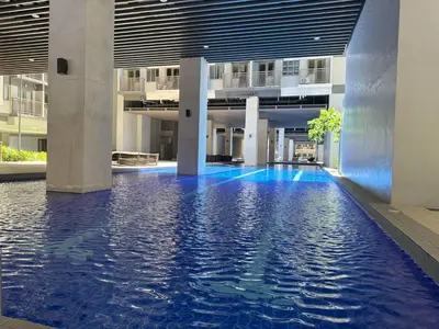 a swimming pool in the middle of a building at LNicoles Pad in Manila