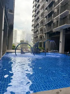 a large swimming pool in a large building at LNicoles Pad in Manila