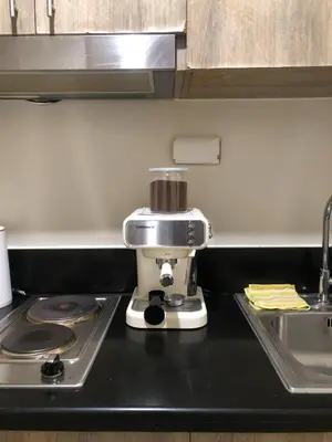 a mixer sitting on top of a kitchen counter at LNicoles Pad in Manila
