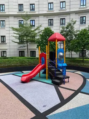 a playground with a slide in front of a building at 81 Newport Blvd Cluster 5 Unit 3F by Rechelle Nunag in Manila