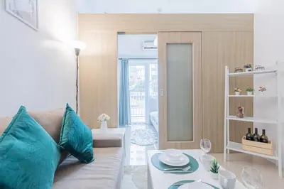 a living room with a couch and a table at BD281 House in Manila