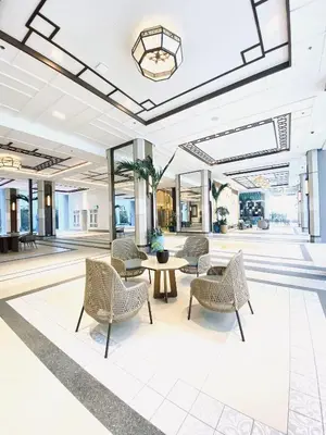 a lobby with chairs and tables in a building at JFam Suites Allegra Condo with Balcony, FREE Parking in Manila