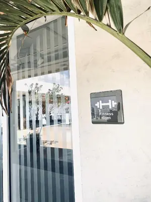 a sign on the door of a building at JFam Suites Allegra Condo with Balcony, FREE Parking in Manila