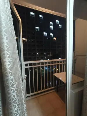 a balcony with a view of a city skyline at Shore residences tower D by Ben in Manila