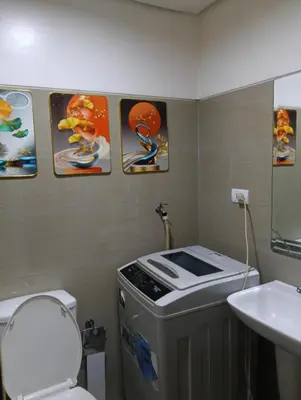 a bathroom with a sink and a washing machine at Shore residences tower D by Ben in Manila