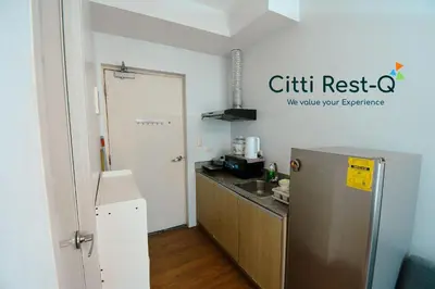 a kitchen with a refrigerator and a sink at The Linear Makati Free Wifi & Netflix LM1 in Manila
