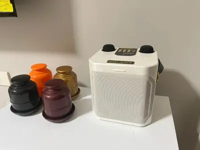 a toaster and three different colored bottles on a counter at Monarch parksuites 1bedroom with free pool access in Manila
