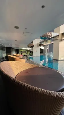 a swimming pool in a building with a large swimming pool at Max 1 Small Pet Allowed! Choose Pet Rate Plan if you have a pet with you! Gramercy Residences at 42nd Floor with Pool and Gym Access in Manila