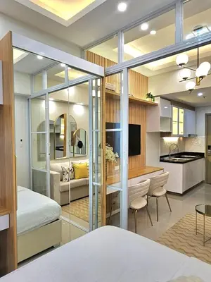 a bedroom and a living room with a bed and a kitchen at Franchelle Bliss - Shore 2 Residences Tower 1 in Manila