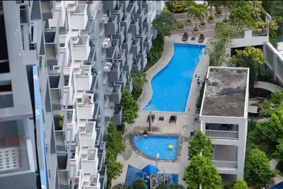 an aerial view of an apartment complex with a swimming pool at Velvet Accommodation PH in Manila