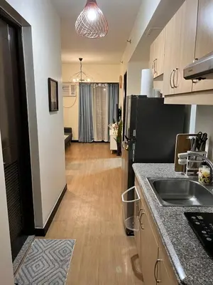 a kitchen with a sink and a counter top at Condo unit in Sucat, Paranaque Calathea Place in Manila