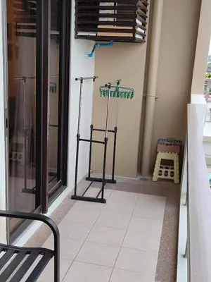 a room with a window with a treadmill on the floor at Condo unit in Sucat, Paranaque Calathea Place in Manila