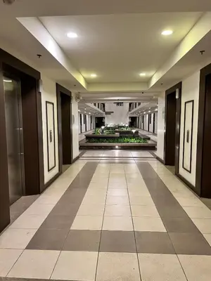 an empty hallway of a building with a lobby at Condo unit in Sucat, Paranaque Calathea Place in Manila