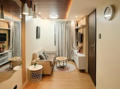 a living room with a couch and a table at Cozy Crib2 in Manila