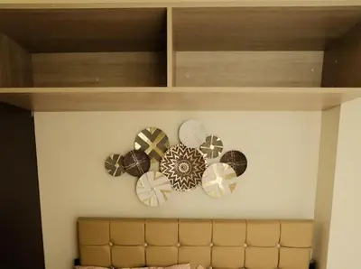 a bunch of clocks on a wall at Cozy Crib2 in Manila