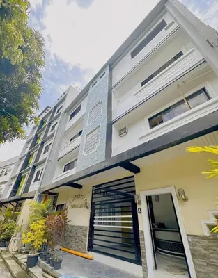 a building with a gate in front of it at Staycation in Alabang in Manila