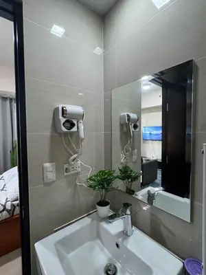a bathroom with a sink and a mirror at 81 Newport Boulevard Condominium across International Airport Terminal 3 C1-4C in Manila