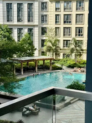 a large swimming pool with people in a building at 81 Newport Boulevard Condominium across International Airport Terminal 3 C1-4C in Manila