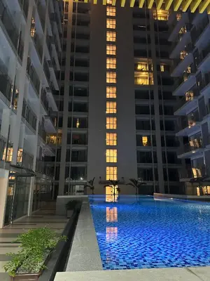 a swimming pool in the middle of a building at Spacious Apartment Hotel near City of Dreams, Airport, MOA, Okada, Ayala Malls, and Solaire Casino with free 5 pool access in Manila