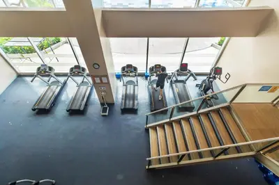 an overhead view of a gym with cardio machines at Kintai Suites at the Beacon in Manila