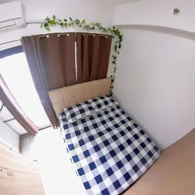 a room with a checkered floor and a curtain at MAKATI - Lush Residences in Manila