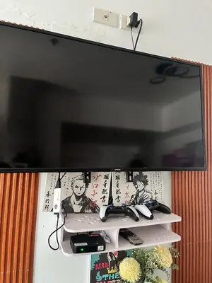 a flat screen tv hanging on a wall at Serenity Escapes by Aj in Manila
