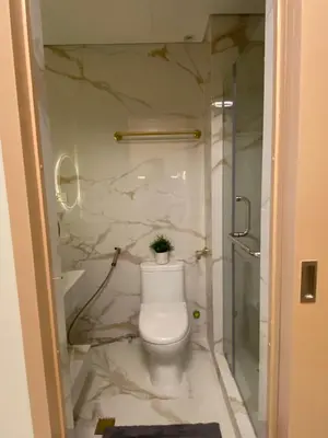 a bathroom with a toilet and a shower at Fairy Dust Sky Suite By Crib2GO in Manila