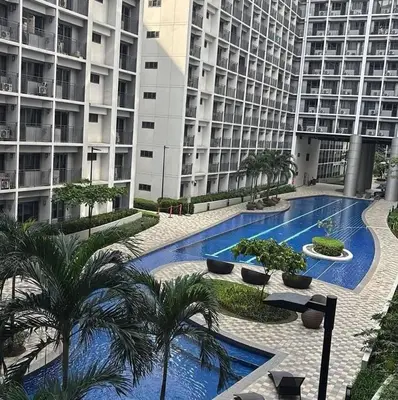 a swimming pool in the middle of a building at Shore Residence Tower 3 in Manila