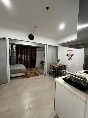 a room with a kitchen and a living room at Azure Condo Maui 1 bedroom in Manila