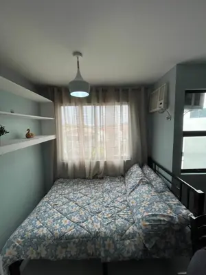 a bedroom with a bed and a window at Chushers place in Santa Rosa