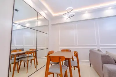 a dining room with a table and chairs at Éire Home Stay in Manila