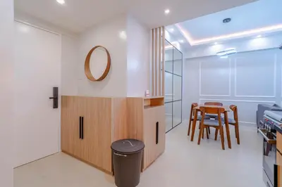 a room with a table and a mirror on the wall at Éire Home Stay in Manila