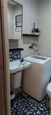 a bathroom with a toilet and a sink and a mirror at Fully Furnished 1 Bedroom Condo - Fame Residences, Tower 2 in Manila