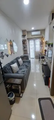 a living room with a couch and a table at Fully Furnished 1 Bedroom Condo - Fame Residences, Tower 2 in Manila
