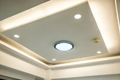 a coffered ceiling with a recessed light at Forbeswood Heights BGC suite near st Lukes in Manila