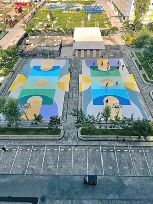 an aerial view of a parking lot with a mural at 1BR with Prime Netflix, Disney HBO max in Manila