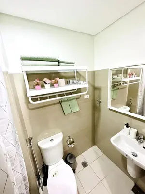a bathroom with a toilet and a sink at FT1161 House in Manila