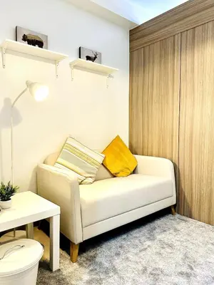 a living room with a couch and a table at FT1161 House in Manila