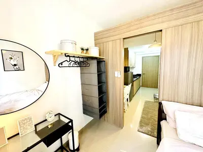 a bedroom with a mirror and a bed and a desk at FT1161 House in Manila