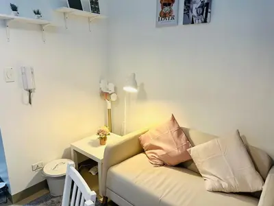 a living room with a couch and a table at MK1661 House in Manila