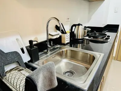 a kitchen with a stainless steel sink in a kitchen at MK1661 House in Manila