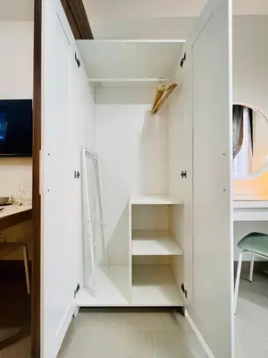 a room with white walls and shelves at TM1410 House in Manila