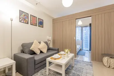 a living room with a couch and a table at SB1054 House in Manila