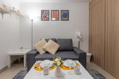 a living room with a couch and a table at SB1054 House in Manila