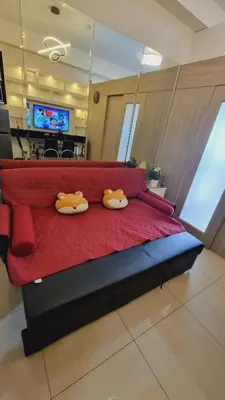 a red bed with two ducks on top of it at Carps Staycation in Manila