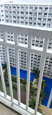 a view of a large apartment building from a balcony at Carps Staycation in Manila