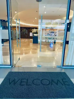 a welcome mat in front of the door of a store at Carps Staycation in Manila