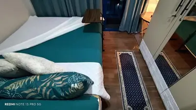 a bedroom with a bunk bed and a stairway with a couch at Air Residence Tower B RM 445 Elegant and cosy Makati condoxd in Manila