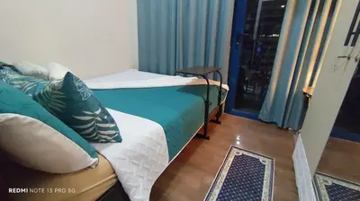 a room with two beds and a window with a view at Air Residence Tower B RM 445 Elegant and cosy Makati condoxd in Manila